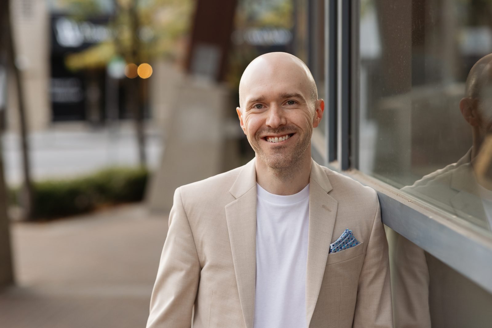Wade Paterson in a beige blazer, smiling
