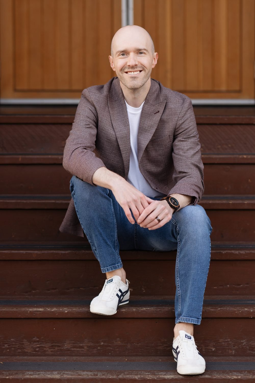 Wade Paterson sitting on wooden steps